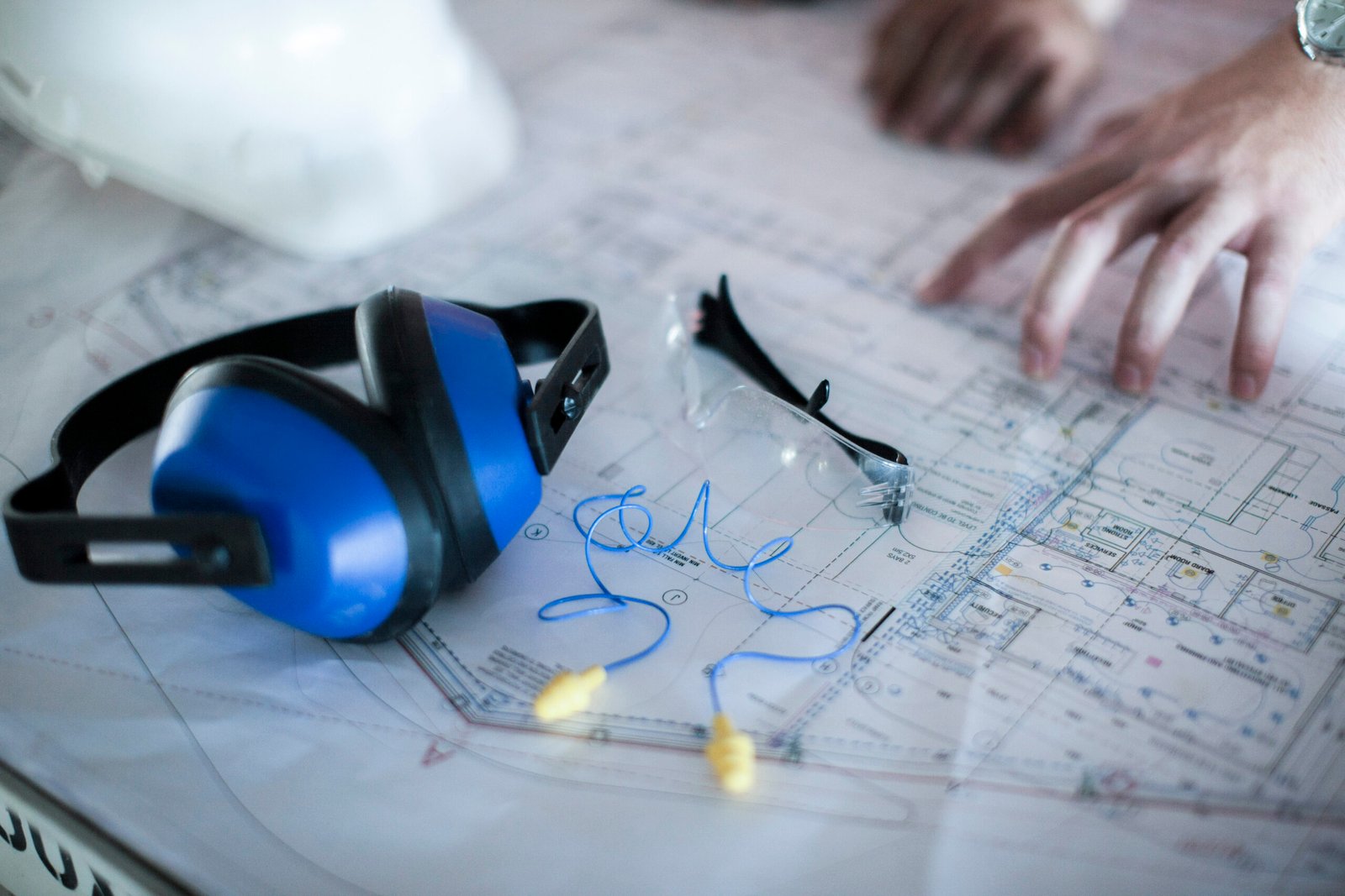 close up of male hands on blueprint in constructio 2026 03 25 01 19 46 utc scaled